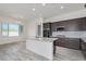Modern kitchen with island and stainless steel appliances at 21048 E Arroyo Verde Dr, Queen Creek, AZ 85142