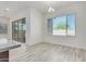 Bright dining area with large window and chandelier at 21048 E Arroyo Verde Dr, Queen Creek, AZ 85142