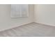 Simple bedroom with carpeted floor and window with blinds at 21048 E Arroyo Verde Dr, Queen Creek, AZ 85142