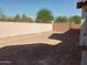Unlandscaped backyard with block wall at 21048 E Arroyo Verde Dr, Queen Creek, AZ 85142