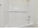 Clean bathroom with a shower/tub combo and white tile at 21048 E Arroyo Verde Dr, Queen Creek, AZ 85142