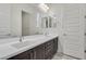 Double vanity bathroom with dark brown cabinets at 21048 E Arroyo Verde Dr, Queen Creek, AZ 85142