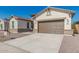 New construction home exterior with two-car garage at 21048 E Arroyo Verde Dr, Queen Creek, AZ 85142