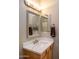 Bathroom vanity with marble countertop and sink at 12956 W El Sueno Ct, Sun City West, AZ 85375