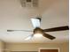 Modern ceiling fan with light kit at 12956 W El Sueno Ct, Sun City West, AZ 85375