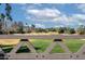 Scenic view of the golf course from behind a wooden fence at 12956 W El Sueno Ct, Sun City West, AZ 85375
