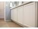 White cabinets under a quartz countertop in the bathroom at 12956 W El Sueno Ct, Sun City West, AZ 85375
