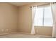 Simple bedroom with carpeted floors and window at 12956 W El Sueno Ct, Sun City West, AZ 85375