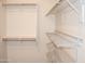 Spacious closet with shelves and hanging rods at 12956 W El Sueno Ct, Sun City West, AZ 85375
