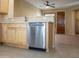 Stainless steel dishwasher in a light wood kitchen at 12956 W El Sueno Ct, Sun City West, AZ 85375