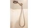Close-up view of a modern shower head with a long, flexible hose at 12956 W El Sueno Ct, Sun City West, AZ 85375