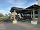 Relaxing patio area with pergola, seating, and bar at 12956 W El Sueno Ct, Sun City West, AZ 85375