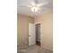 A bright bedroom with neutral walls, carpet flooring, and ceiling fan at 12956 W El Sueno Ct, Sun City West, AZ 85375