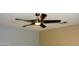 Modern ceiling fan with dark brown blades and a central light at 12956 W El Sueno Ct, Sun City West, AZ 85375
