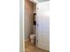 Clean bathroom with toilet and storage cabinet at 12956 W El Sueno Ct, Sun City West, AZ 85375