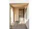 Covered entryway with a security door and a small welcome mat at 12956 W El Sueno Ct, Sun City West, AZ 85375