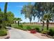 Paved path alongside the lush green golf course at 12956 W El Sueno Ct, Sun City West, AZ 85375