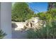 Outdoor patio area with a stone fireplace at 12956 W El Sueno Ct, Sun City West, AZ 85375