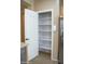 Open pantry with five shelves for food storage at 12956 W El Sueno Ct, Sun City West, AZ 85375
