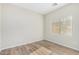 Bedroom with wood-look floors and window at 10722 W Jefferson St, Avondale, AZ 85323