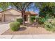 Single-story house with a landscaped front yard and a two-car garage at 10722 W Jefferson St, Avondale, AZ 85323