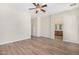 Spacious bedroom with ensuite bathroom access and wood-look floors at 10722 W Jefferson St, Avondale, AZ 85323