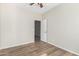 Simple bedroom with wood-look floors and ceiling fan at 10722 W Jefferson St, Avondale, AZ 85323