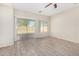 Living room with sliding glass door to backyard at 10722 W Jefferson St, Avondale, AZ 85323