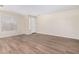 Bright living room with wood-look flooring and neutral walls at 10722 W Jefferson St, Avondale, AZ 85323