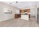 Spacious kitchen with an island, stainless steel appliances, and wood cabinets at 10722 W Jefferson St, Avondale, AZ 85323