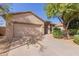 House exterior with two-car garage and landscaped yard at 10722 W Jefferson St, Avondale, AZ 85323