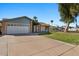 Single-story home with attached garage and spacious yard at 2409 E Hampton Ave, Mesa, AZ 85204