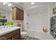 Clean bathroom with white bathtub and dark wood vanity at 12303 W Candlelight Dr, Sun City West, AZ 85375