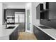 Modern kitchen with stainless steel appliances and dark cabinetry at 100 W Northern Ave # 2, Phoenix, AZ 85021