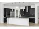 Modern kitchen with sleek, dark cabinetry and large island at 100 W Northern Ave # 2, Phoenix, AZ 85021
