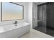 Spa-like bathroom with soaking tub and walk-in shower at 100 W Northern Ave # 2, Phoenix, AZ 85021