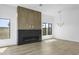 Bright living room with hardwood floors and modern fireplace at 100 W Northern Ave # 2, Phoenix, AZ 85021