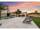 Expansive backyard with pool, lounge chairs, and a beautiful sunset view at 341 E Monte Vista Rd, Phoenix, AZ 85004