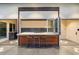 Modern outdoor kitchen with a pass-through window and bar seating at 341 E Monte Vista Rd, Phoenix, AZ 85004