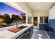 Modern outdoor kitchen with a built in sink and expansive backyard view at 341 E Monte Vista Rd, Phoenix, AZ 85004