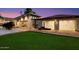 Contemporary home exterior with a large yard and three-car garage at 341 E Monte Vista Rd, Phoenix, AZ 85004