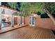 Spacious wooden deck with access to the dining room and backyard at 341 E Monte Vista Rd, Phoenix, AZ 85004