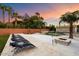 Luxury pool area with lounge chairs and fire pit at 341 E Monte Vista Rd, Phoenix, AZ 85004