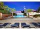 Inviting pool area with lounge chairs and a beautiful water feature at 341 E Monte Vista Rd, Phoenix, AZ 85004