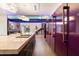 Modern kitchen with purple refrigerator, marble countertop, and open floor plan at 341 E Monte Vista Rd, Phoenix, AZ 85004