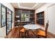 Elegant china closet with glass shelving, showcasing dishes and glassware at 341 E Monte Vista Rd, Phoenix, AZ 85004