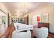 Living room with white sofa and chairs, hardwood floors, and chandelier at 341 E Monte Vista Rd, Phoenix, AZ 85004