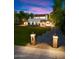 Evening view of a charming two-story home with a spacious lawn at 341 E Monte Vista Rd, Phoenix, AZ 85004