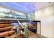 Modern glass and metal staircase with city views at 341 E Monte Vista Rd, Phoenix, AZ 85004