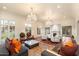 Spacious living room with hardwood floors, fireplace, and large windows at 341 E Monte Vista Rd, Phoenix, AZ 85004